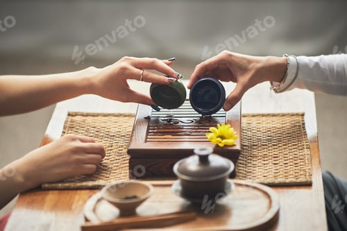 Preview: Asian Young Women Performing Traditional Tea Ceremony Ritual Indoors Together