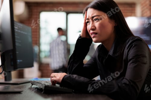 Preview: Confused tech engineer sitting at computer trying to solve network processing errors.