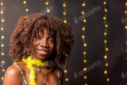 Preview: Smiling African American woman with curly hair looking at camera