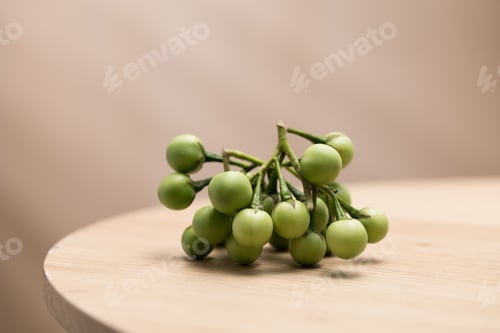 Preview: Turkey berries, a common ingredient in Thai cuisine, are displayed on a wooden surface.