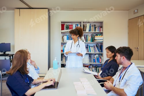 Preview: Medical team meeting: doctors and nurses collaborating in hospital setting