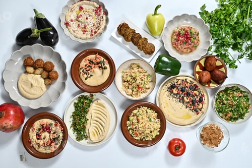Preview: various food dishes displayed next to an apple and a pepper