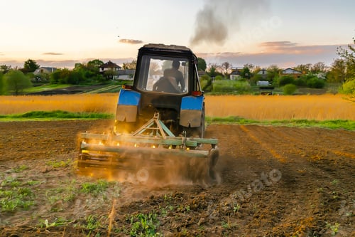 Preview: tractor machinery plowing agricultural field at farm.cultivating,soil tillage seeding plants,crops