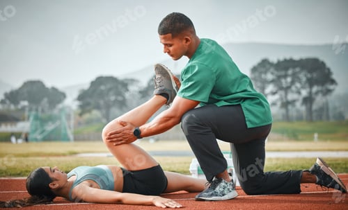 Preview: Man Assisting Woman with Leg Stretching on Track