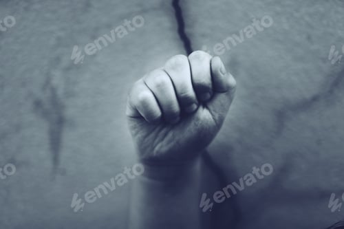 Preview: Blurred Close up of black and white blurred photo kid raised hands protesters