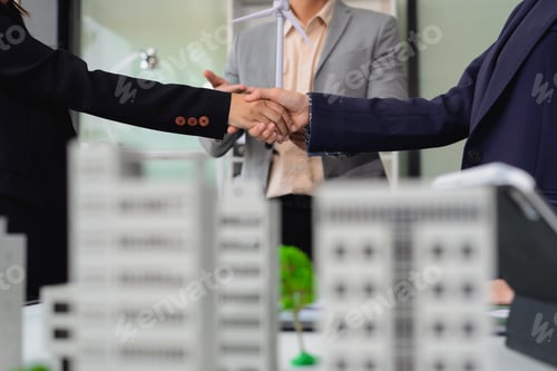 Preview: Businessmen shake hands after agreeing to start a new project successfully
