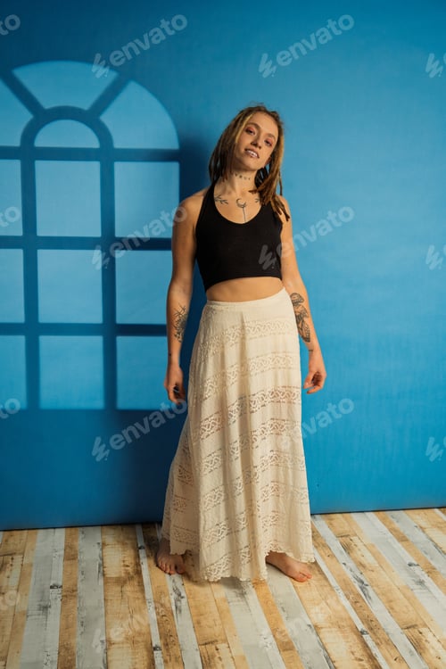 Preview: Woman Poses in Black Top and White Skirt
