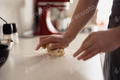 Preview: Close-up hands kneading dough on kitchen counter