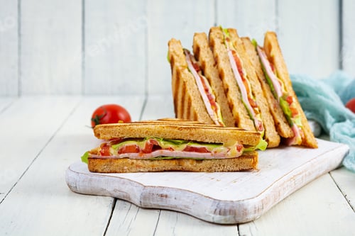 Preview: Club sandwich with ham, tomato, green and cheese. Grilled panini