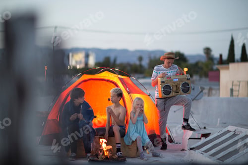 Preview: Friends enjoying a rooftop camping adventure at dusk