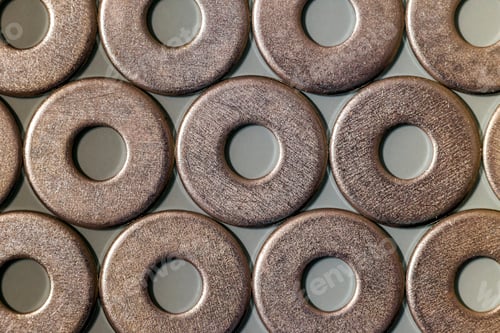 Preview: Joiner's accessories. Stacks of metal screw washers isolated on