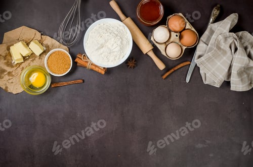 Preview: Ingredients for making dough dishes: cakes, cookies, muffins, pies on a dark background.