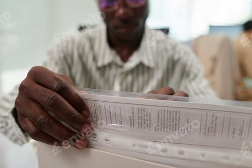 Preview: Office Manager Pulling out Document