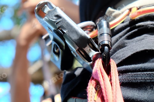 Preview: Mountain climber wearing carabiners