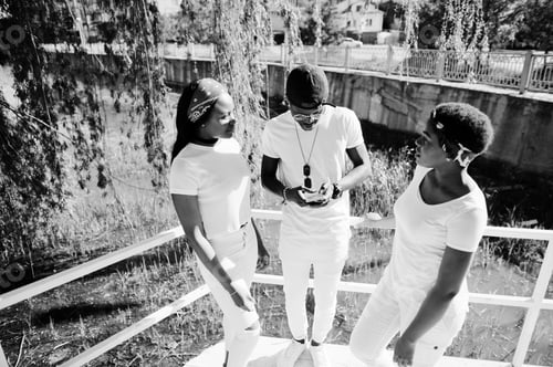 Preview: Stylish african american friends in white