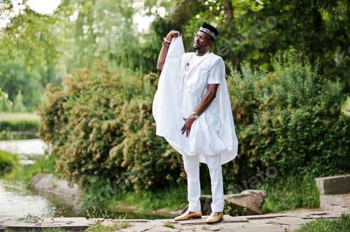 Preview: Rich black man at white national dress