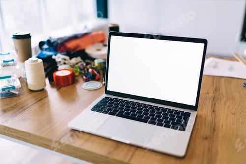 Preview: Opened laptop with white screen on workplace