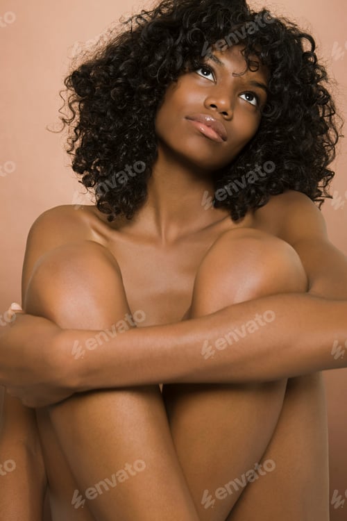 Preview: Contemplative beauty embracing herself