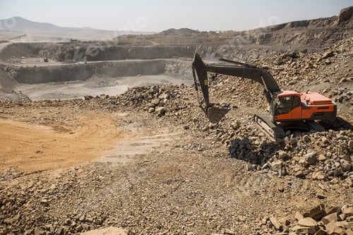 Preview: Excavator working in a large quarry.