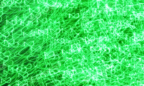 Preview: Long exposure shot creating vibrant green abstract light trails against a dark background