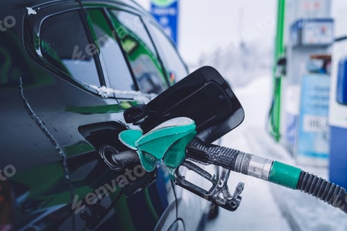 Preview: Automobile stopping on gas station during winter travel