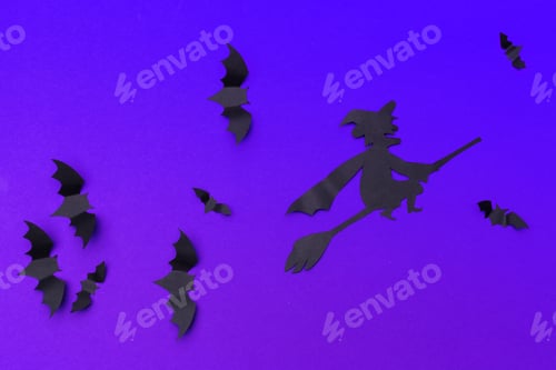 Preview: halloween and decoration concept - paper bats flying