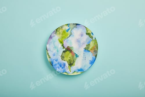 Preview: top view of planet picture on turquoise background, earth day concept