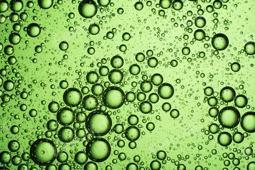 Preview: light green oil bubbles on the water
