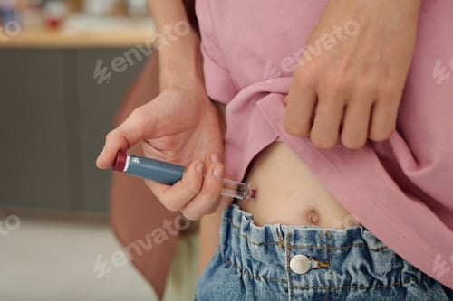 Preview: Close Up of Mother Holding Insulin Pen to Administer Injection