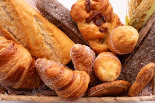 Preview: Close-up on bakery - various kinds of breadstuff. Rye bread, wholemeal, baguette, sweet bakery produ