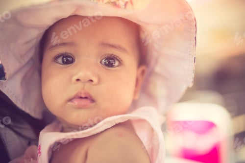 Preview: Close up Baby girl in hat.vintage color