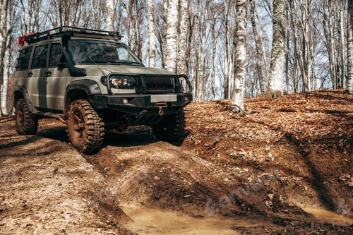 Preview: Offroad car driving through the forest road of mud