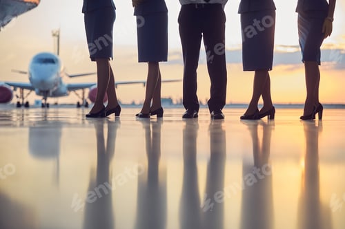 Preview: Females and males enjoying beautiful sunset in the airport