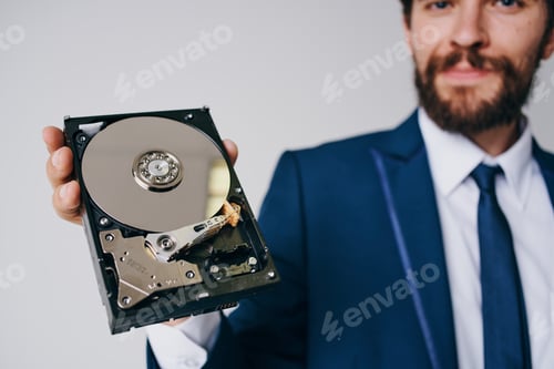 Preview: man holding a hard drive information protection technology