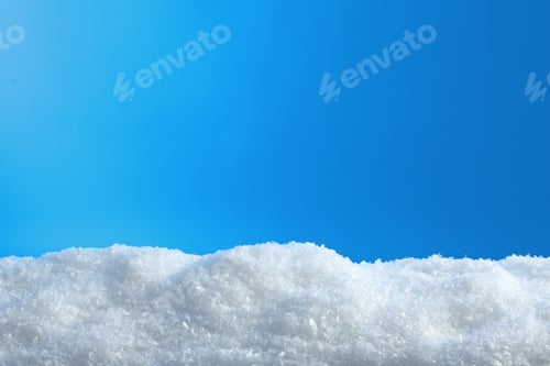 Preview: White snow drift on blue background. Winter weather