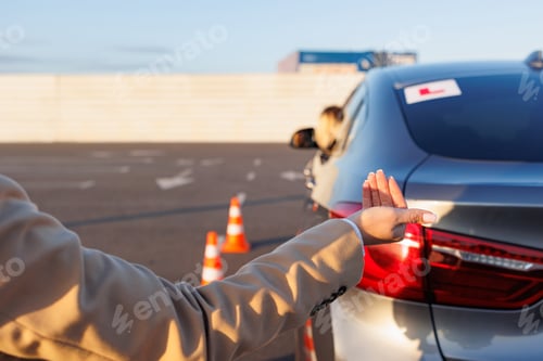 Preview: Instructor Giving Hand Signals to Learner Driver