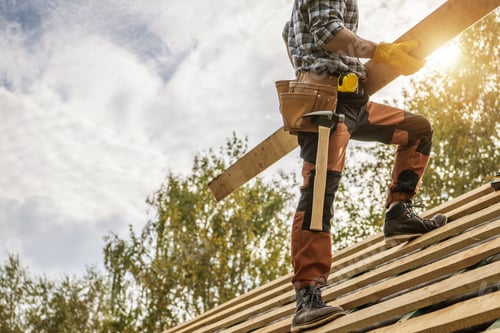 Preview: Building Construction Site Roof Worker with a Plank in His Hands