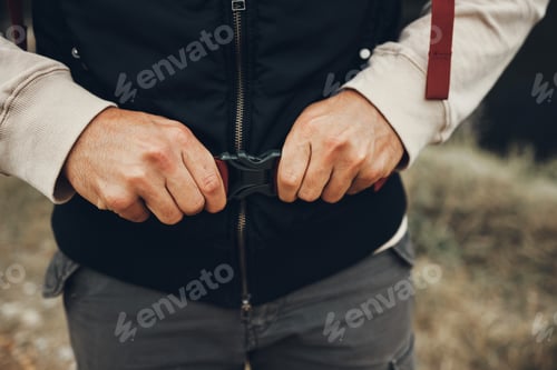 Preview: Hands, backpack strap and person hiking in nature on holiday, vacation and travel. Closeup, trekkin