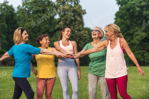Preview: Senior women training with fitness coach at park