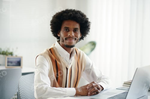 Preview: Businessman Sitting at Office Desk