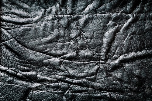 Preview: Background with black textured leather with folds