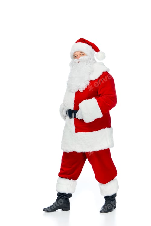 Preview: bearded santa claus walking in red costume at christmastime isolated on white