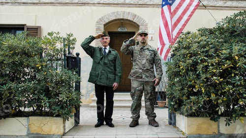 Preview: American Military Man And Veteran Greeting Father And Son In Front Of House