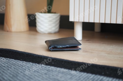 Preview: left wallet on floor at home