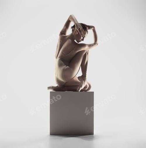 Preview: Ballerina. Young graceful female ballet dancer dancing at studio. Beauty of classic ballet.