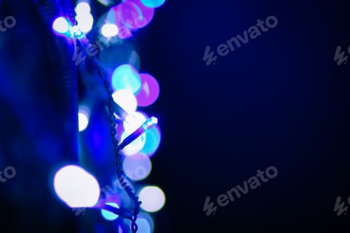 Preview: Abstract bokeh background. Blurred garland lights.