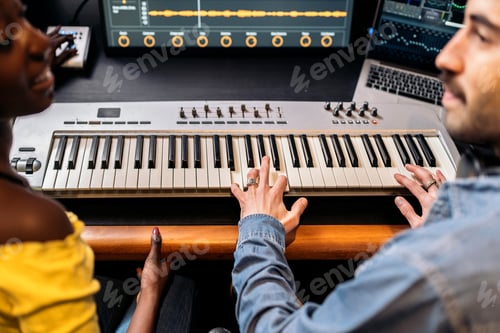 Preview: Two Adults Playing Keyboard in Recording Studio