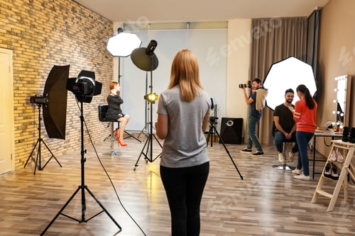 Preview: Photo studio with professional equipment and team of workers