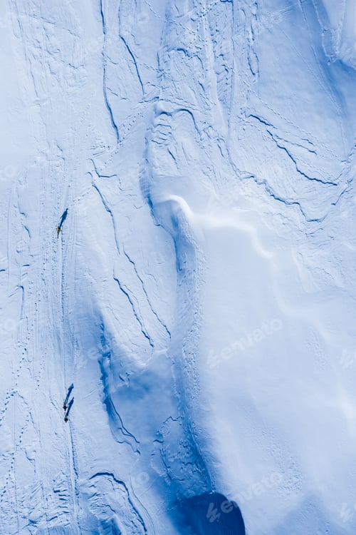 Preview: Drone image of mountains in winter. Image with snow, texture and shadows.