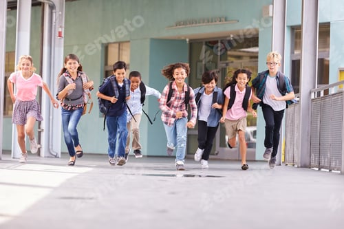 Preview: Group of elementary school kids running in a school corridor